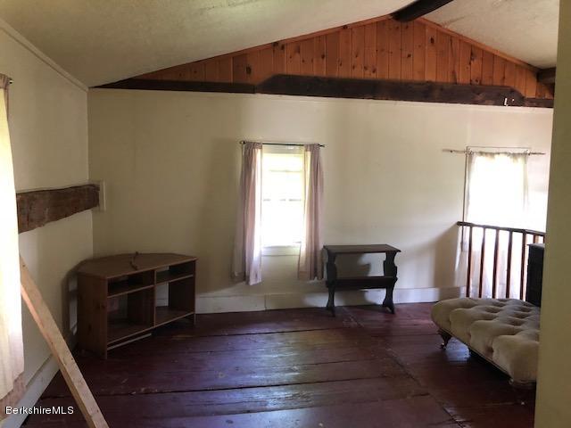 25 Sandisfield Road Sandisfield, MA 01255 - Photo 13 of 32 a living room with furniture and a fireplace
