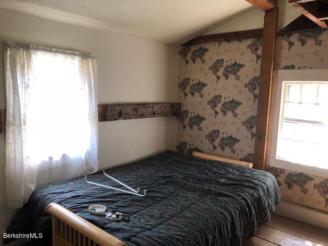 25 Sandisfield Road Sandisfield, MA 01255 - Photo 15 of 32 a bedroom with a bed and a window