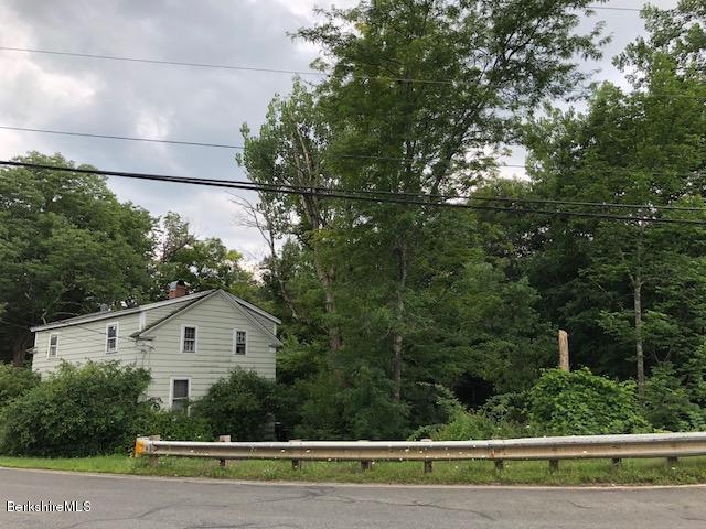 25 Sandisfield Road Sandisfield, MA 01255 - Photo 26 of 32 a view of a big house with a big yard and large trees