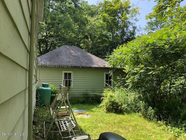 25 Sandisfield Road Sandisfield, MA 01255 - Photo 7 of 32 a backyard of a house with seating space