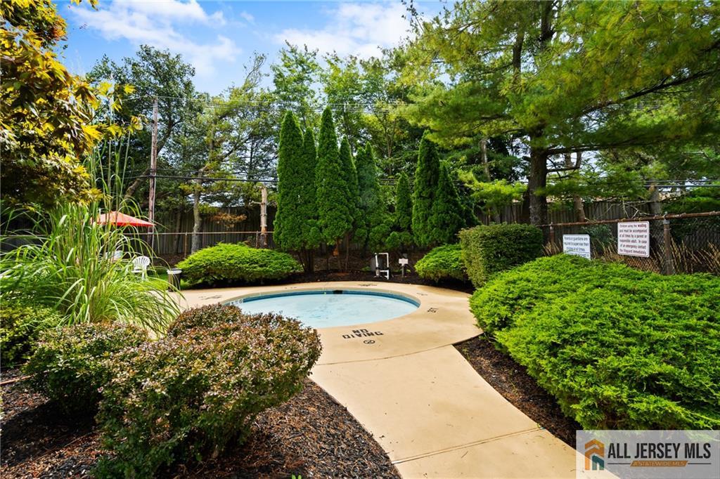 132 The Orchard, Unit L Cranbury, NJ 08512 - Photo 9 of 10 a view of a backyard