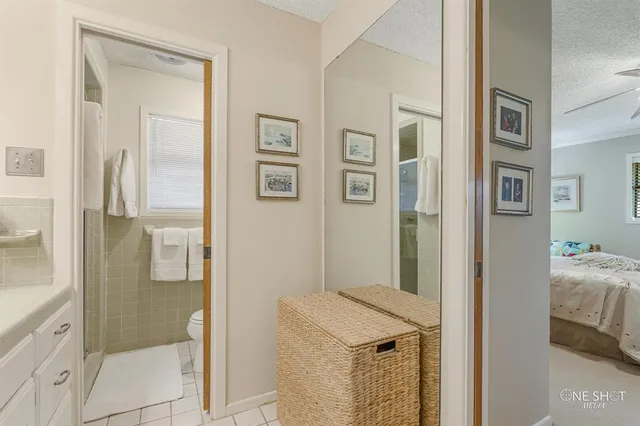 a bedroom with furniture and a book shelf