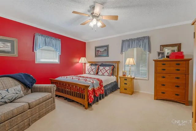 a bathroom with a granite countertop sink a toilet and a mirror