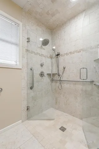 a bedroom that has a bed and a desk chair