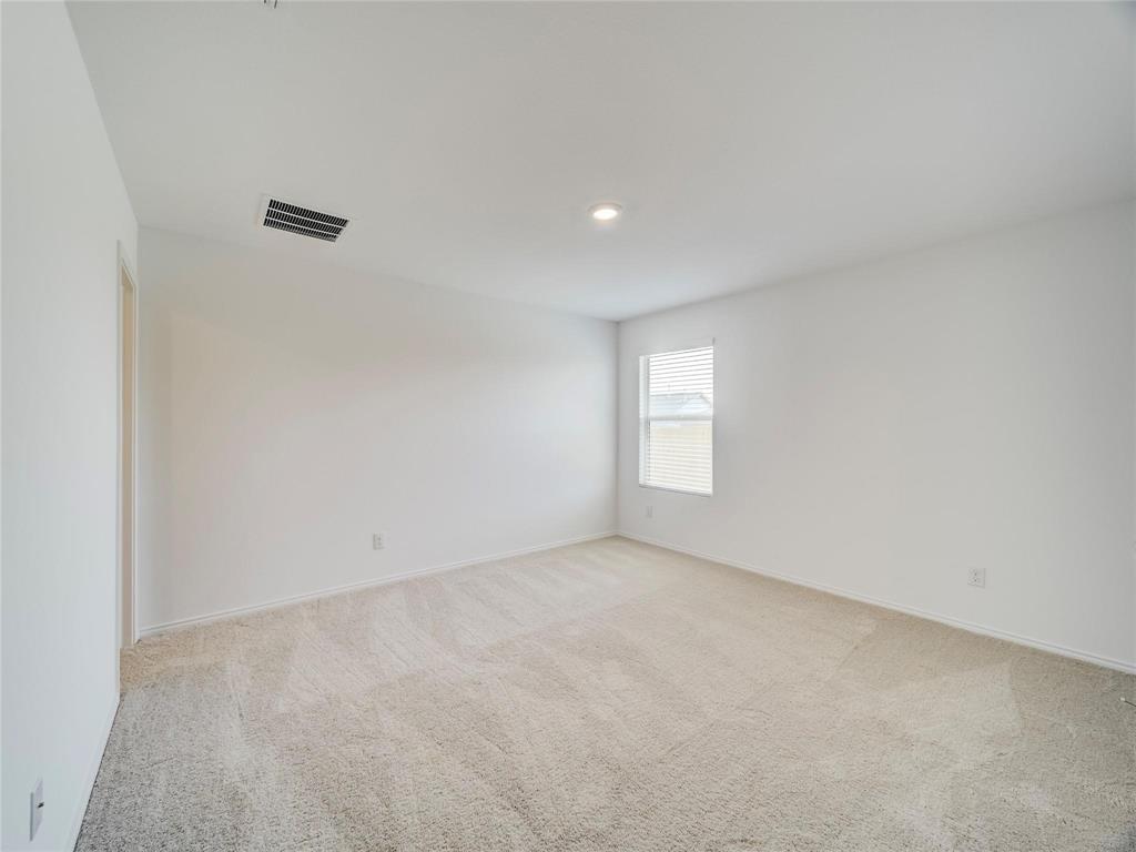 357 Sun Bluff Road Fort Worth, TX 76052 - Photo 31 of 35 Spacious room featuring neutral carpeting, white walls, a single window with horizontal blinds, and a recessed ceiling light