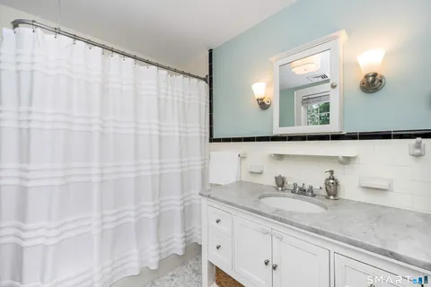 a utility room with sink dryer and washer