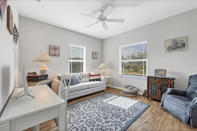a living room with furniture and a rug