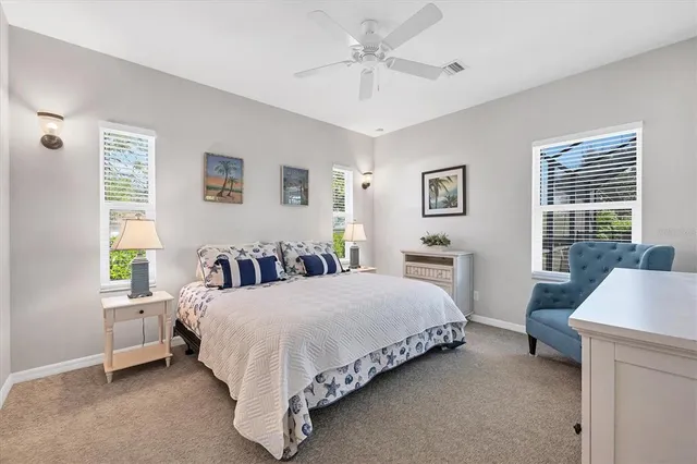 a bedroom with a bed and a desk