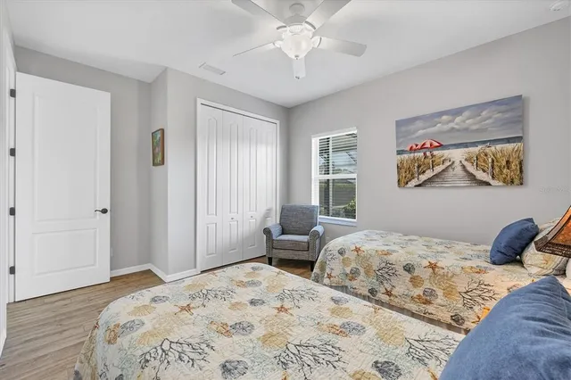 a bedroom with a large bed and a window