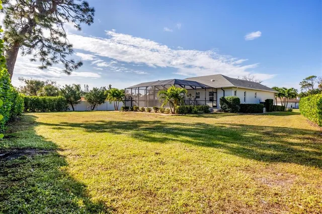 a view of a yard with a tree