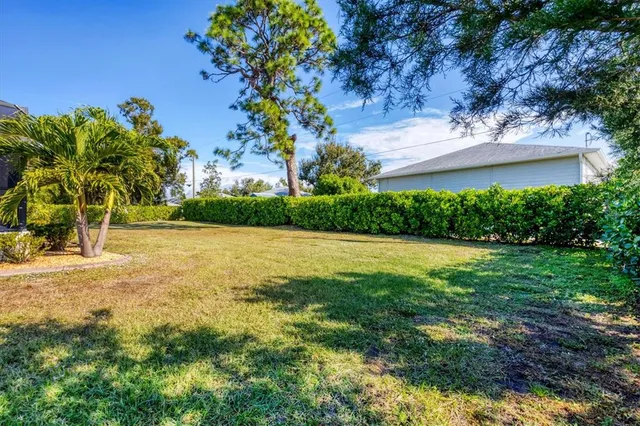 a view of a swimming pool with an outdoor space and seating area