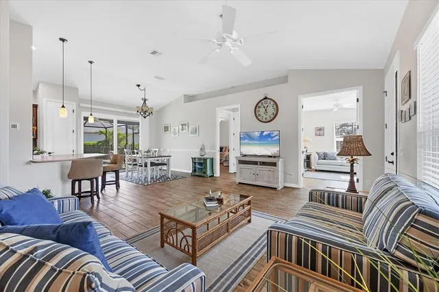 a living room with lots of furniture and a clock