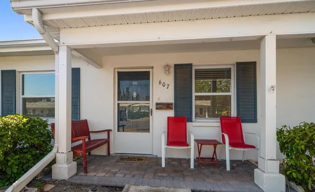 a room with furniture and a potted plant