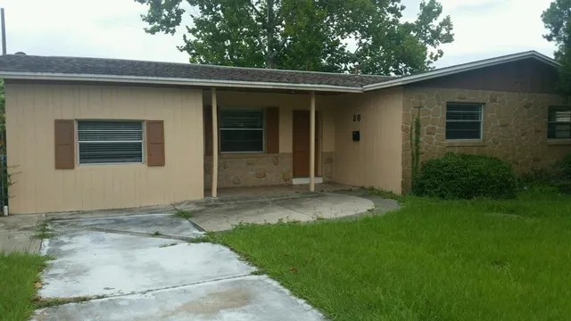 a backyard of a house with seating space