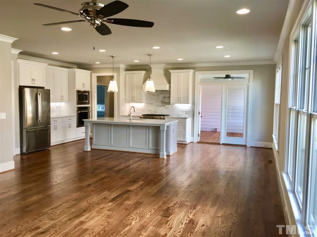 1501 Nottingham Road Raleigh, NC 27607 - Photo 13 of 25 a kitchen with stainless steel appliances granite countertop a refrigerator and a stove top oven