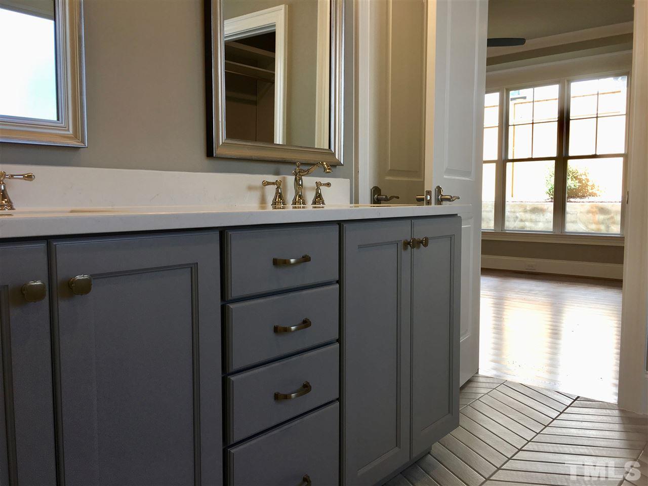1501 Nottingham Road Raleigh, NC 27607 - Photo 14 of 25 a bathroom with a sink and a mirror