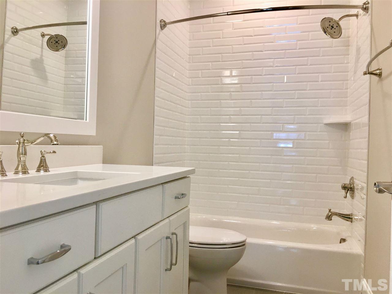 1501 Nottingham Road Raleigh, NC 27607 - Photo 19 of 25 a bathroom with a granite countertop sink toilet and shower