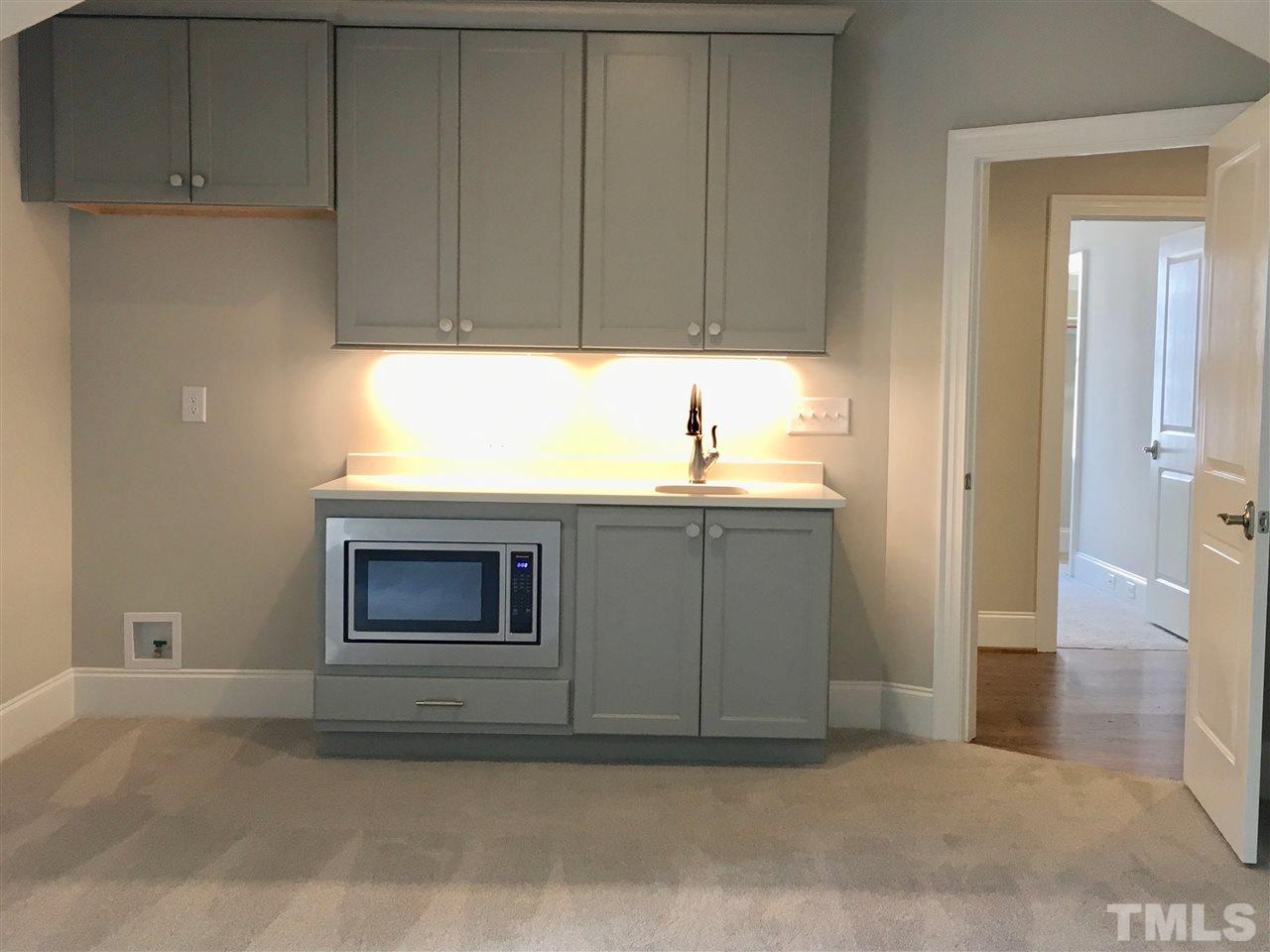 1501 Nottingham Road Raleigh, NC 27607 - Photo 22 of 25 a kitchen with a sink and cabinets