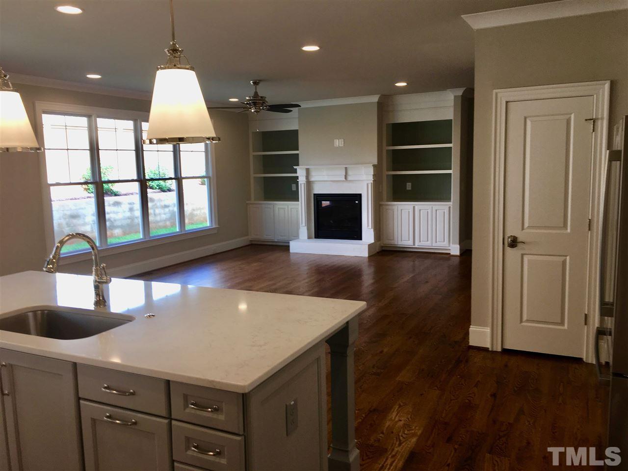 1501 Nottingham Road Raleigh, NC 27607 - Photo 24 of 25 a kitchen with granite countertop a stove and a refrigerator