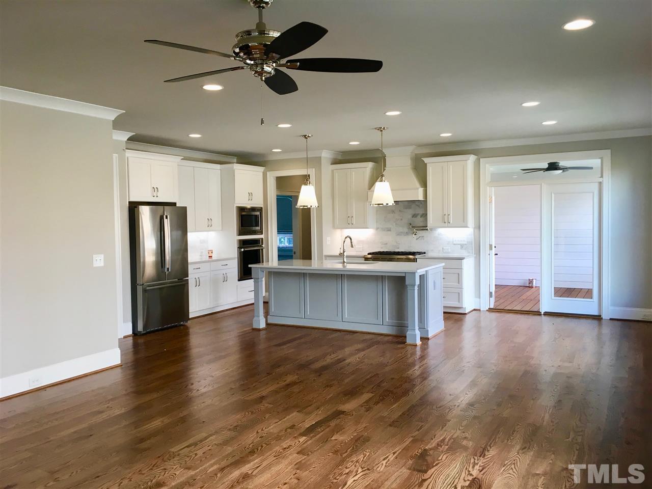 1501 Nottingham Road Raleigh, NC 27607 - Photo 25 of 25 a open kitchen with stainless steel appliances granite countertop a refrigerator and a stove top oven