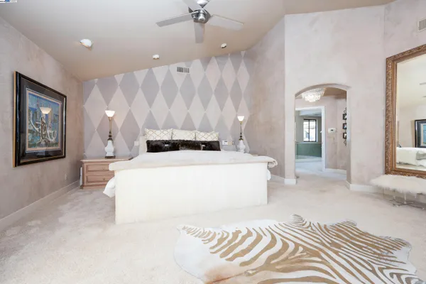 a bathroom with a large tub and shower