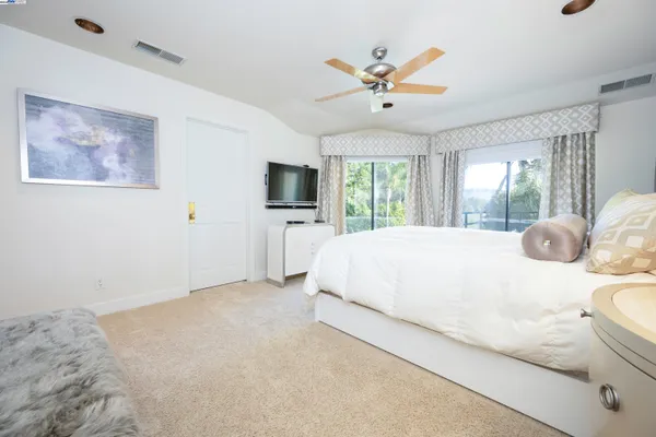 a bed room with a bed and a night stand