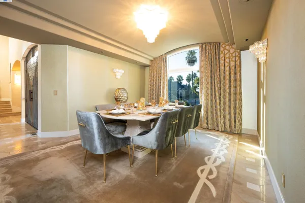 a view of a dining room with furniture window and outside view