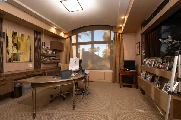 a view of a livingroom with furniture and windows
