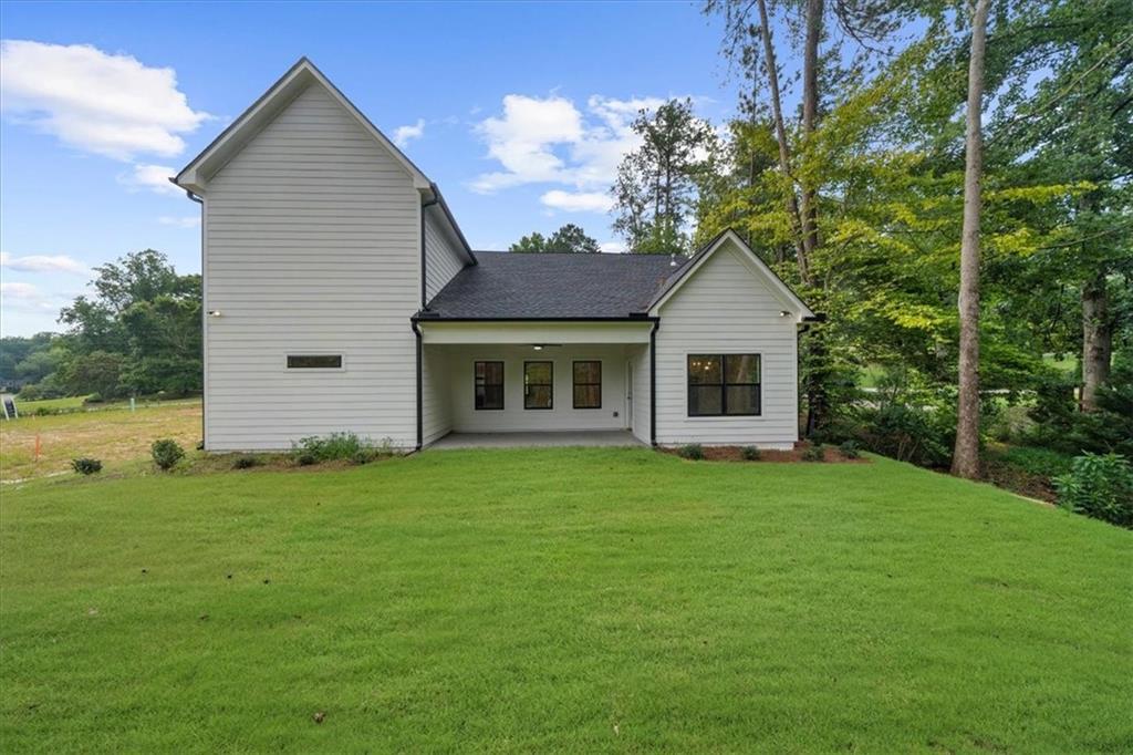 504 Level Creek Road Sugar Hill, GA 30518 - Photo 43 of 54 a front view of a house with a garden