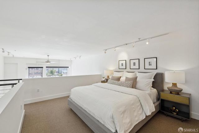 a bedroom with a bed and a cabinets