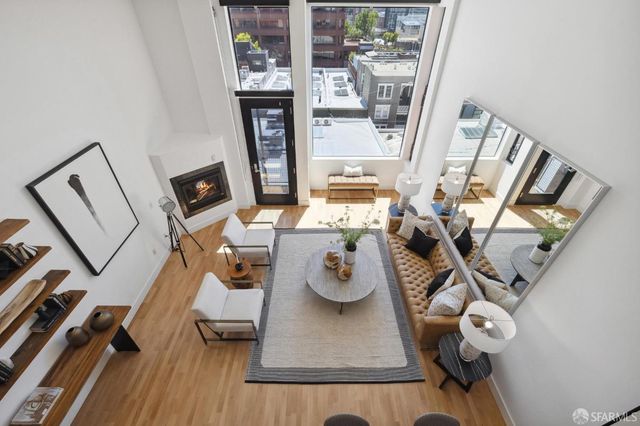 a view of living room with furniture and a window