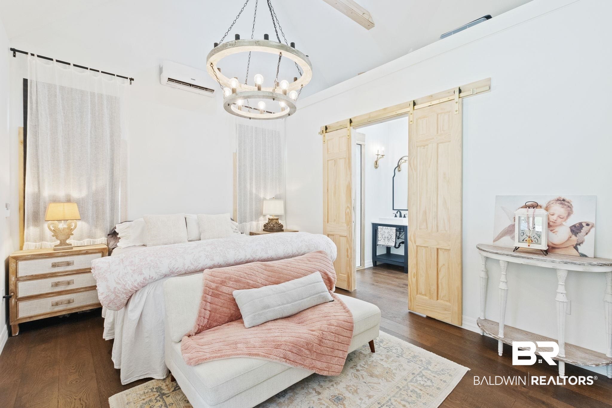 11855 Heather Dells Lane Foley, AL 36535 - Photo 22 of 48 Bedroom with a wall mounted air conditioner, dark wood-type flooring, a chandelier, and a barn door
