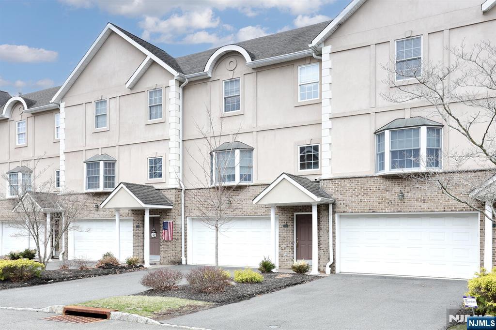 108 Demarest Lane Montvale, NJ 07645 - Photo 2 of 17 a view of a white house with large windows