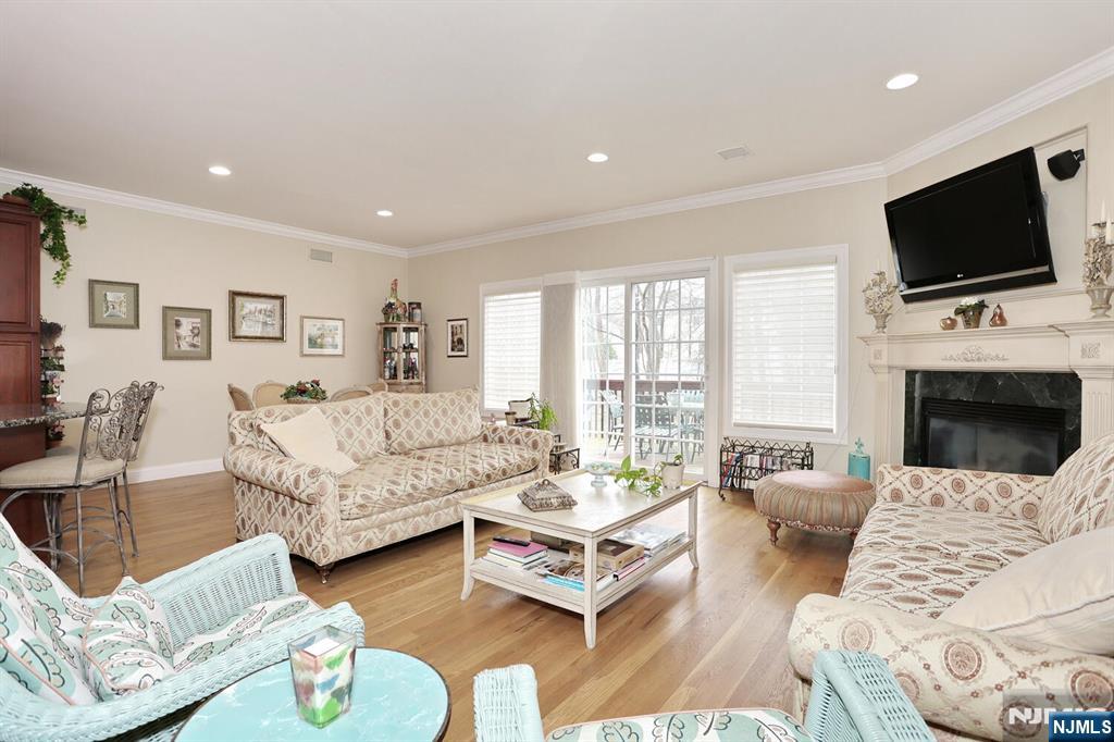 108 Demarest Lane Montvale, NJ 07645 - Photo 6 of 17 a living room with furniture flat screen tv and a fireplace