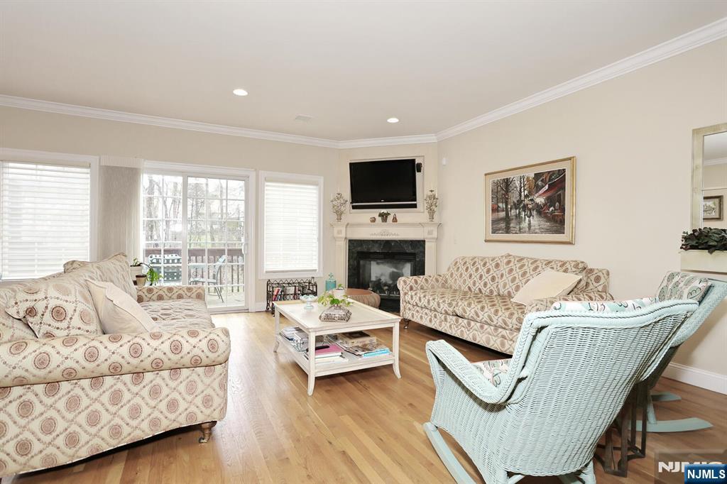108 Demarest Lane Montvale, NJ 07645 - Photo 10 of 17 a living room with furniture fireplace and a flat screen tv