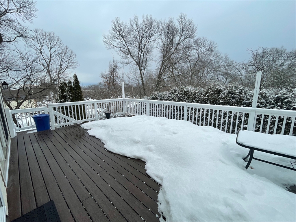 4 Indiana Avenue, Unit 4 Woburn, MA 01801 - Photo 24 of 26 a view of balcony with wooden floor and outdoor seating