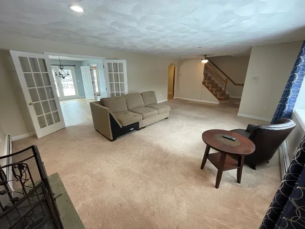 a living room with furniture and a rug