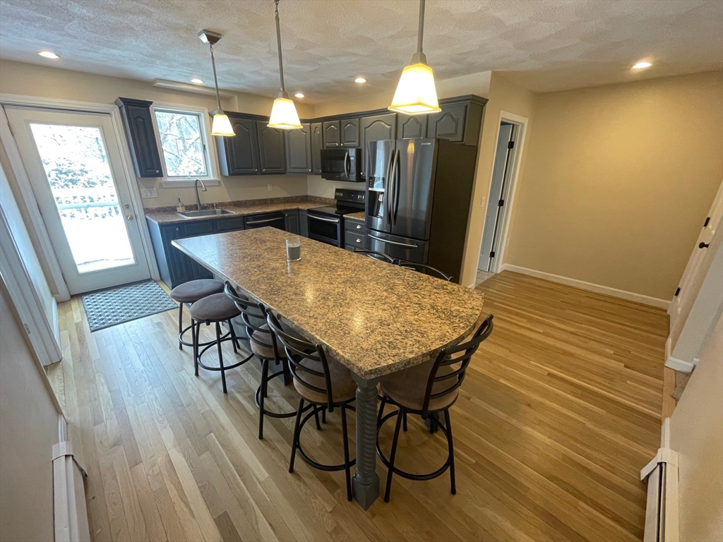4 Indiana Avenue, Unit 4 Woburn, MA 01801 - Photo 10 of 26 a view of a dining room with furniture and window