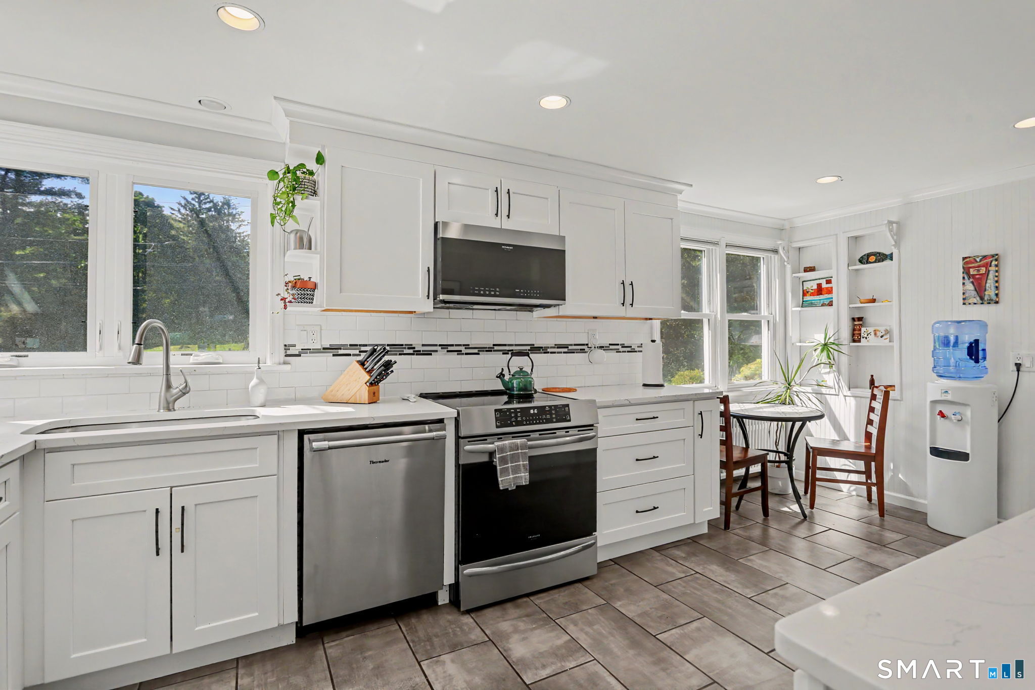 2 Rising Road Norwalk, CT 06850 - Photo 10 of 33 a kitchen with a sink stove and microwave