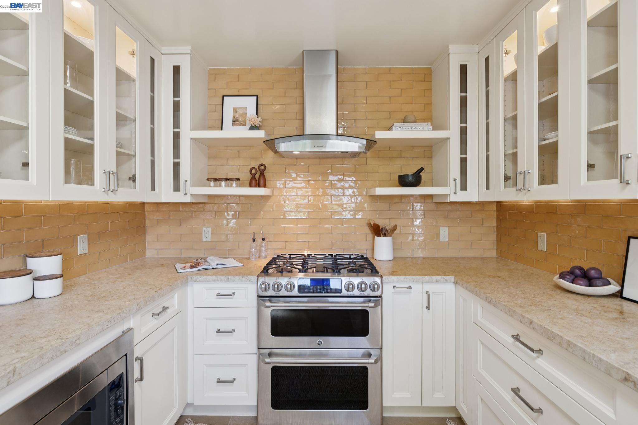 1635 High Street Alameda, CA 94501 - Photo 18 of 56 a kitchen with stainless steel appliances a stove and a white cabinets