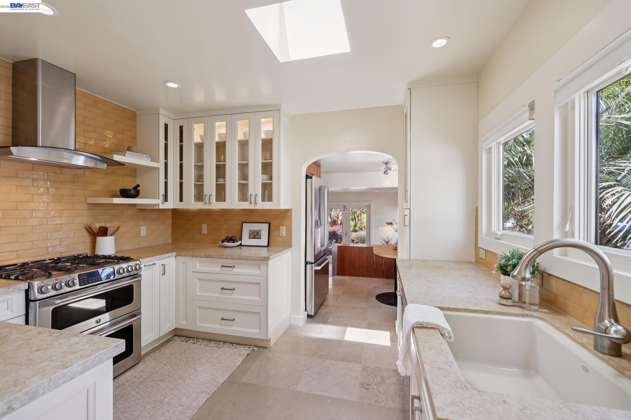 1635 High Street Alameda, CA 94501 - Photo 19 of 56 a kitchen with stainless steel appliances granite countertop a stove and a sink
