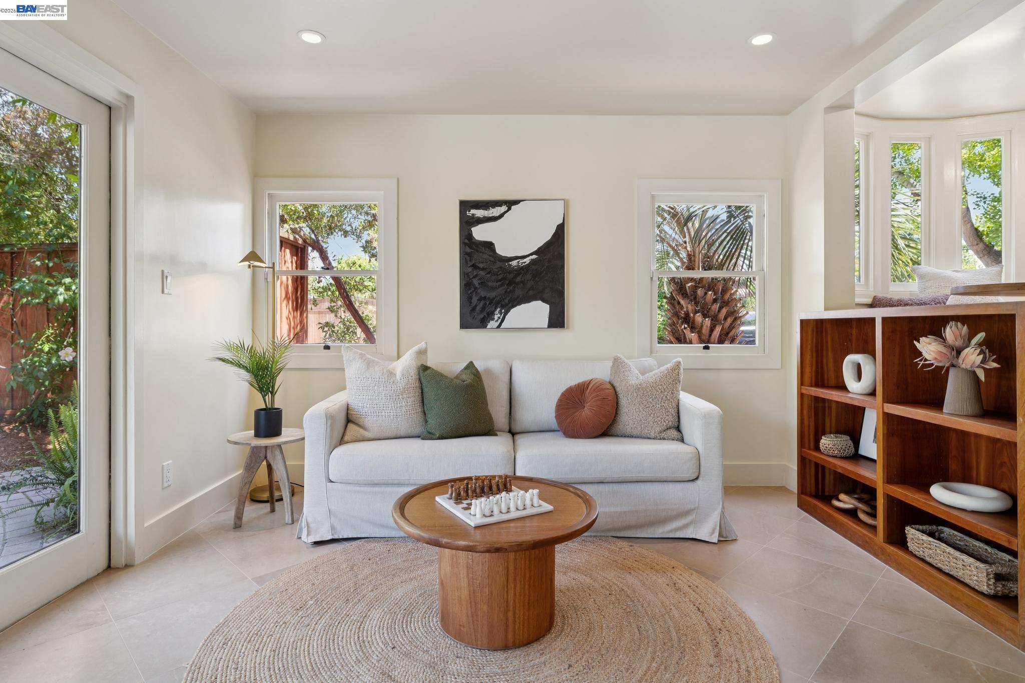 1635 High Street Alameda, CA 94501 - Photo 23 of 56 a living room with furniture and a painting on the wall