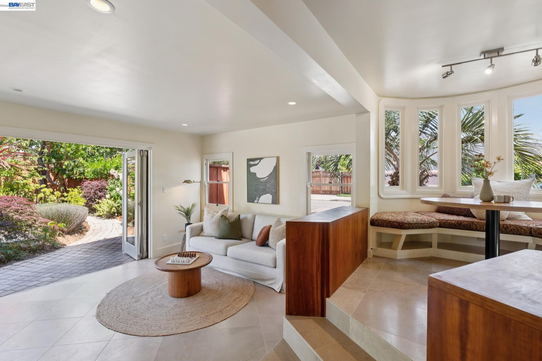 1635 High Street Alameda, CA 94501 - Photo 26 of 56 a living room with furniture a window and a potted plant