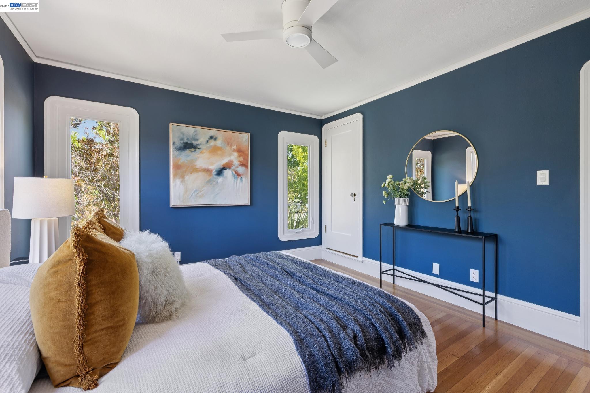 1635 High Street Alameda, CA 94501 - Photo 40 of 56 a bedroom with a bed lamp and paintings on the wall