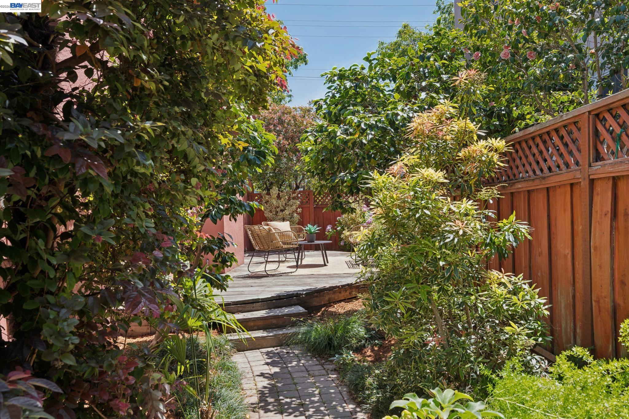 1635 High Street Alameda, CA 94501 - Photo 51 of 56 a view of a garden with plants and large trees