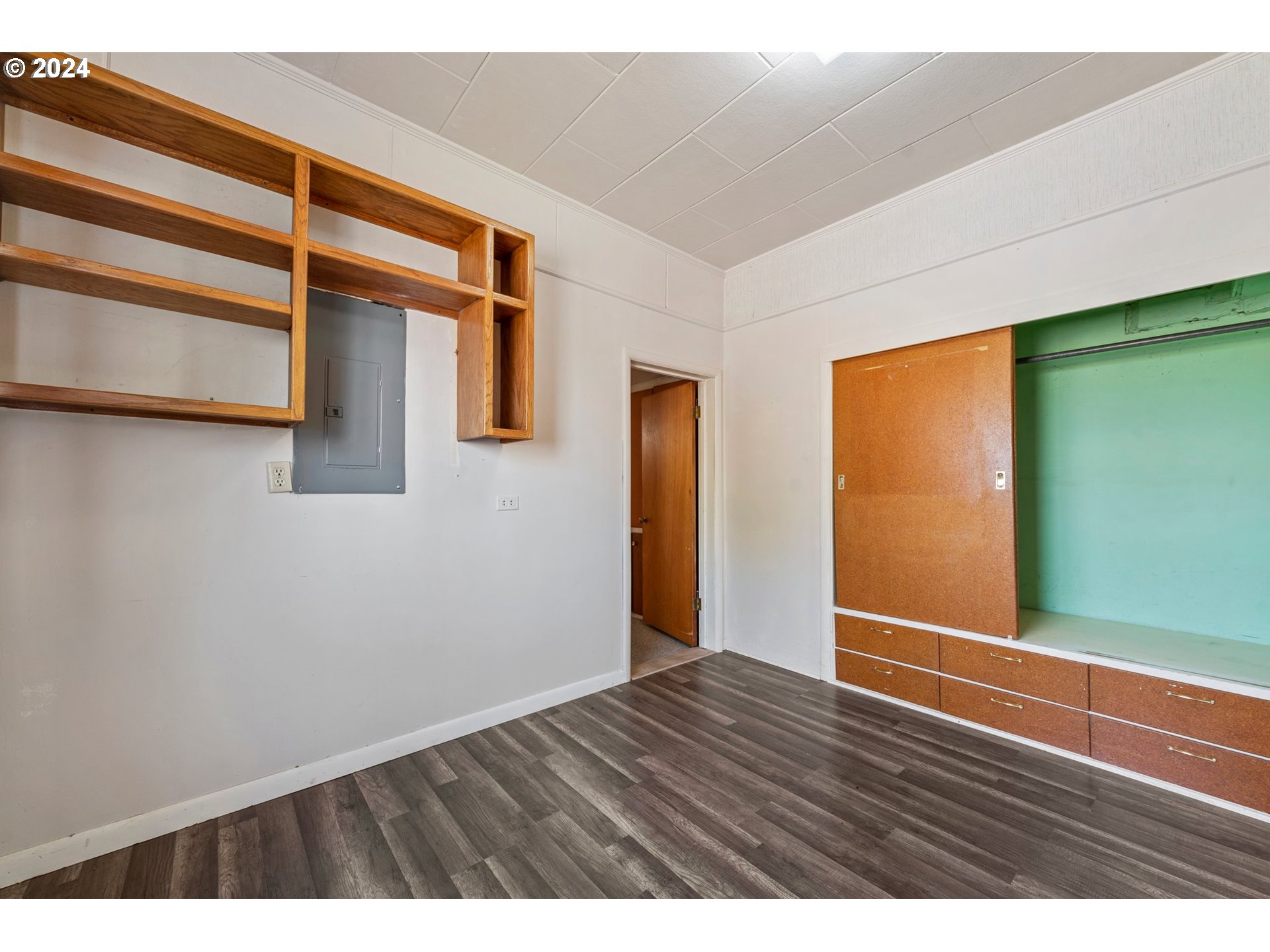 42811 Hudson Road Baker City, OR 97814 - Photo 12 of 46 a view of an empty room with wooden floor and a window