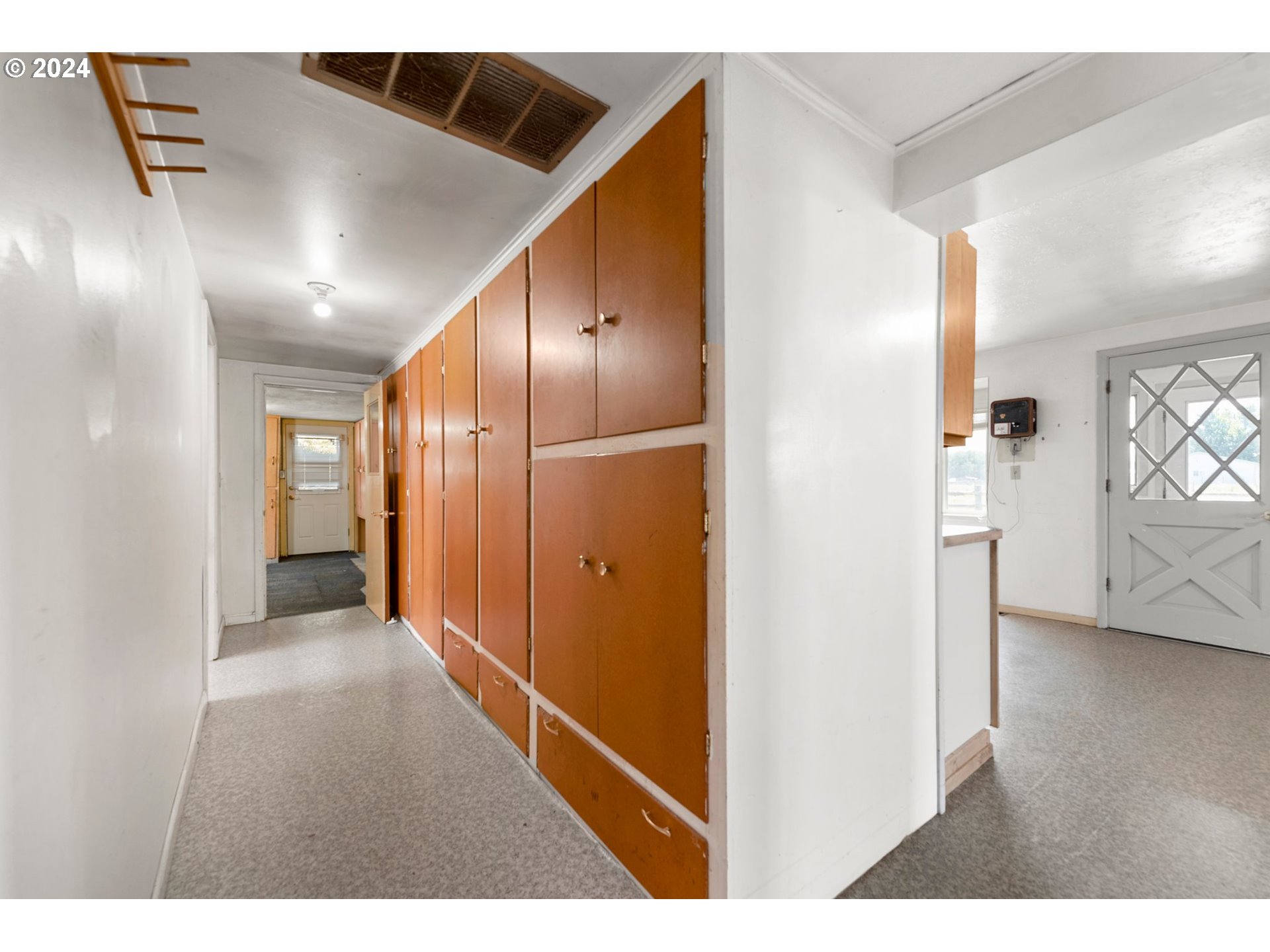 42811 Hudson Road Baker City, OR 97814 - Photo 13 of 46 a view of hallway with wooden floor