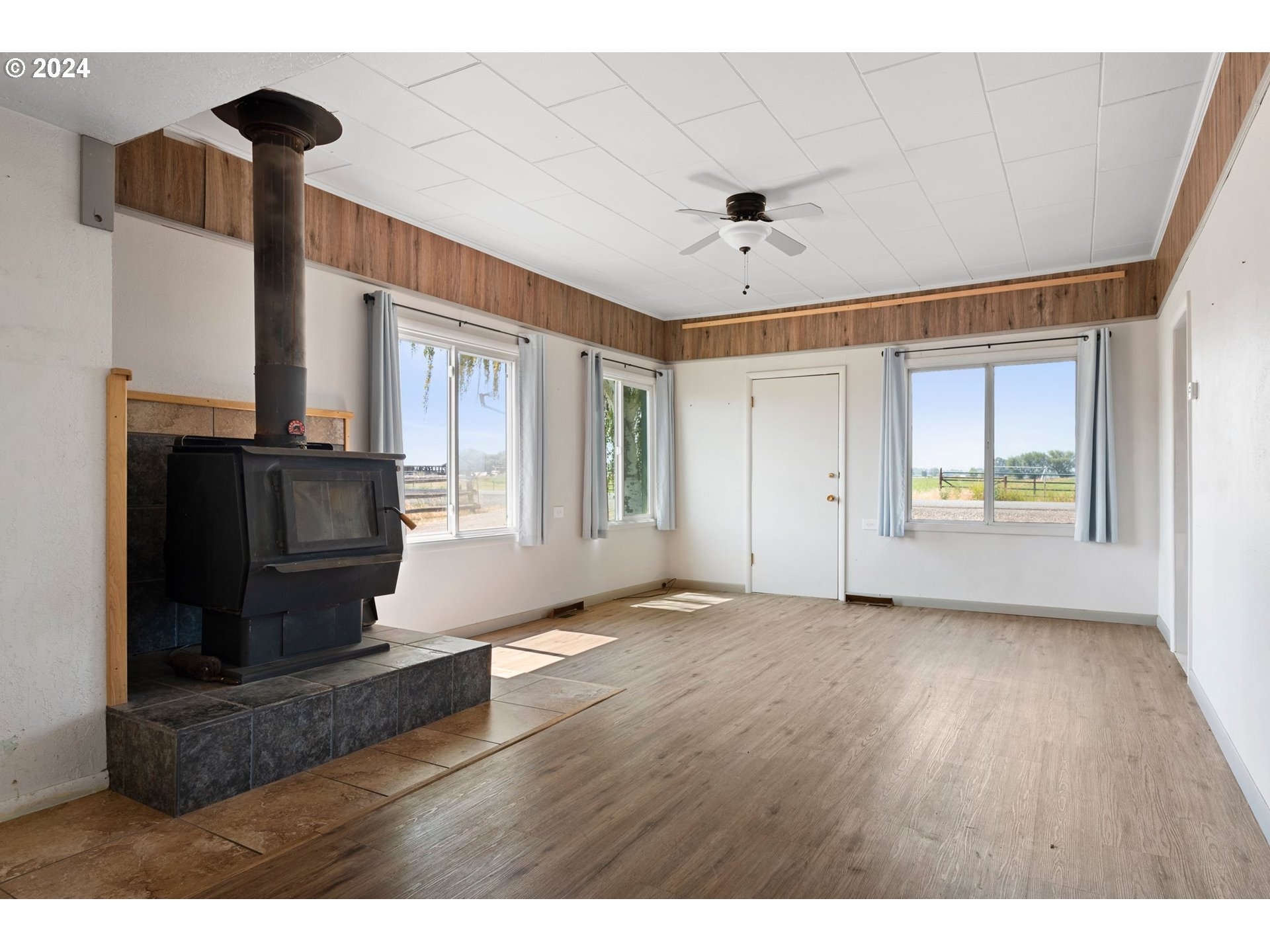 42811 Hudson Road Baker City, OR 97814 - Photo 15 of 46 a view of an empty room with a fireplace and a window