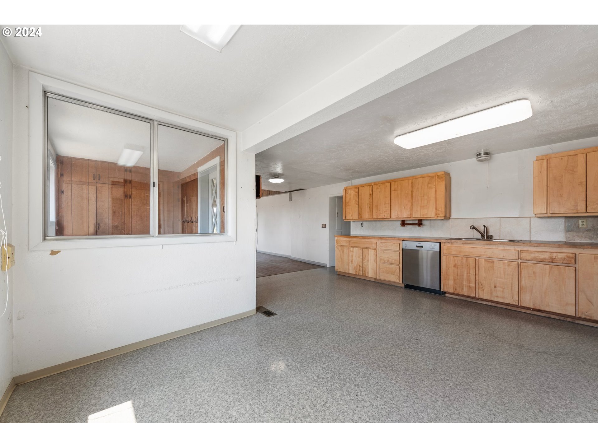 42811 Hudson Road Baker City, OR 97814 - Photo 16 of 46 a view of a kitchen with white cabinets
