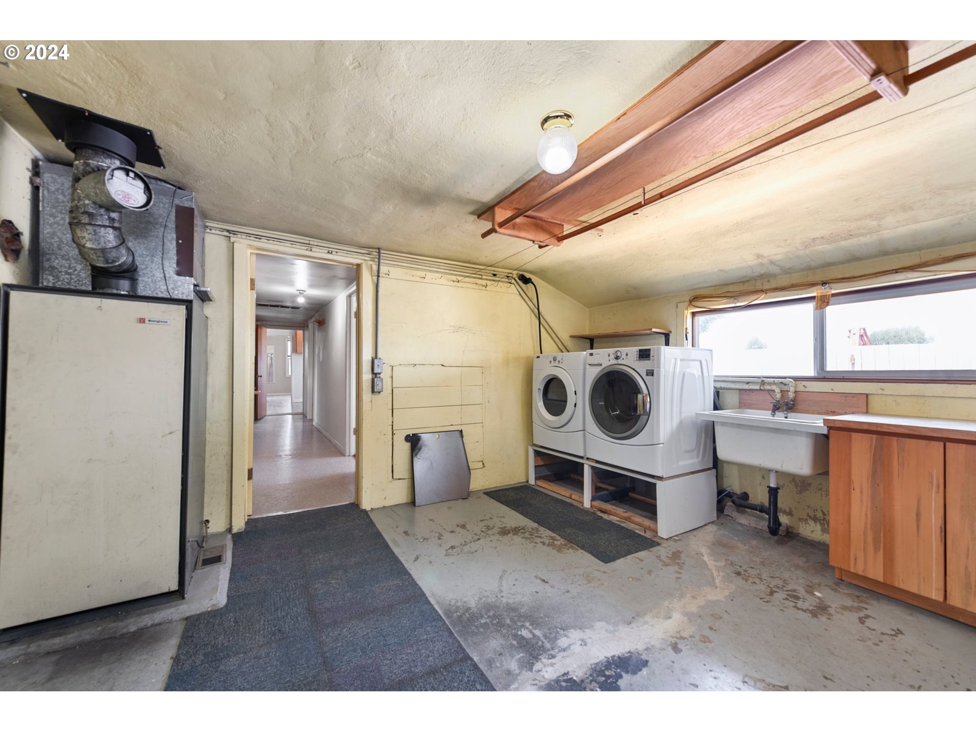 42811 Hudson Road Baker City, OR 97814 - Photo 26 of 46 a living room with furniture and a clock